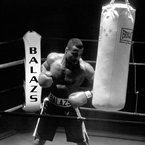 Balazs Fitness Boxer Hitting Heavy Bag in Boxing Ring